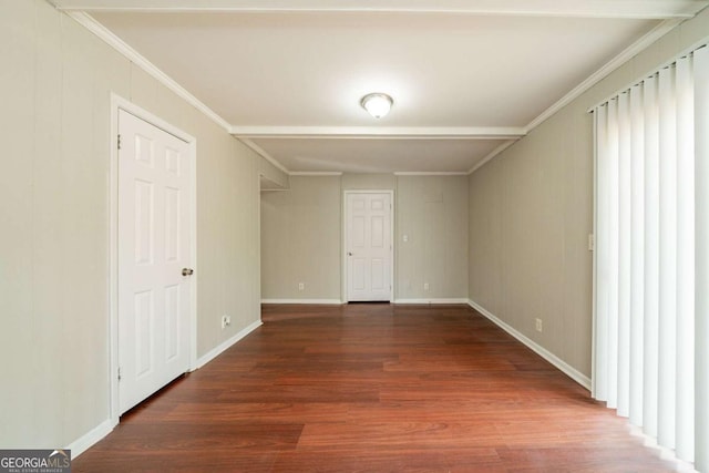 spare room with dark hardwood / wood-style floors and ornamental molding