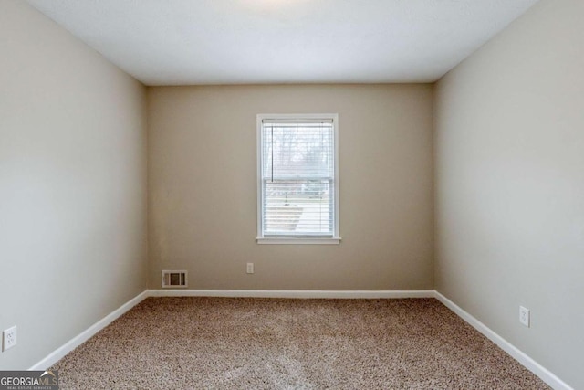 spare room with carpet floors