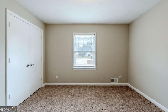 unfurnished bedroom with carpet floors