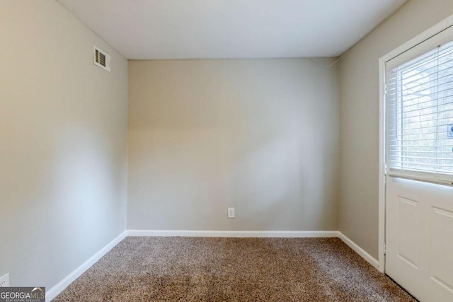 unfurnished room featuring carpet flooring