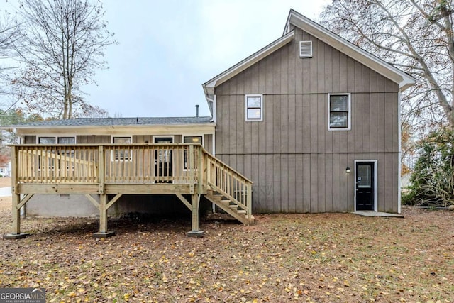 back of property featuring a wooden deck