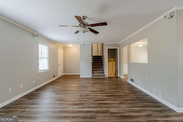 unfurnished living room featuring ornamental molding, ceiling fan, and dark wood-type flooring