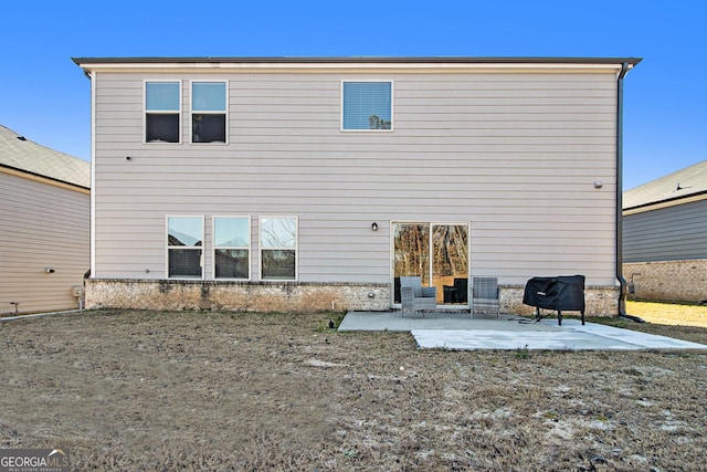 back of house with a patio