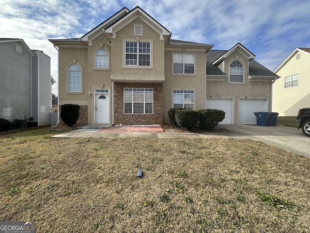 front of property with a front lawn and a garage