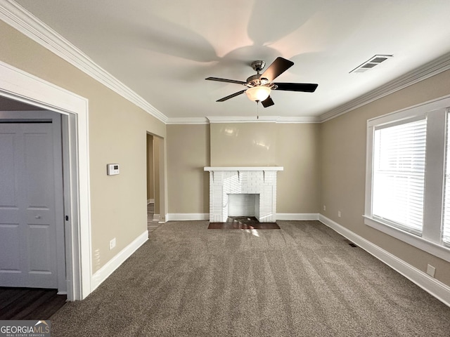 unfurnished living room with crown molding, a fireplace, and dark colored carpet