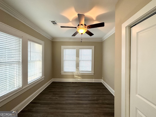 unfurnished room with dark hardwood / wood-style floors, ceiling fan, and ornamental molding