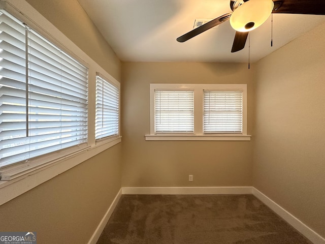 carpeted empty room with ceiling fan