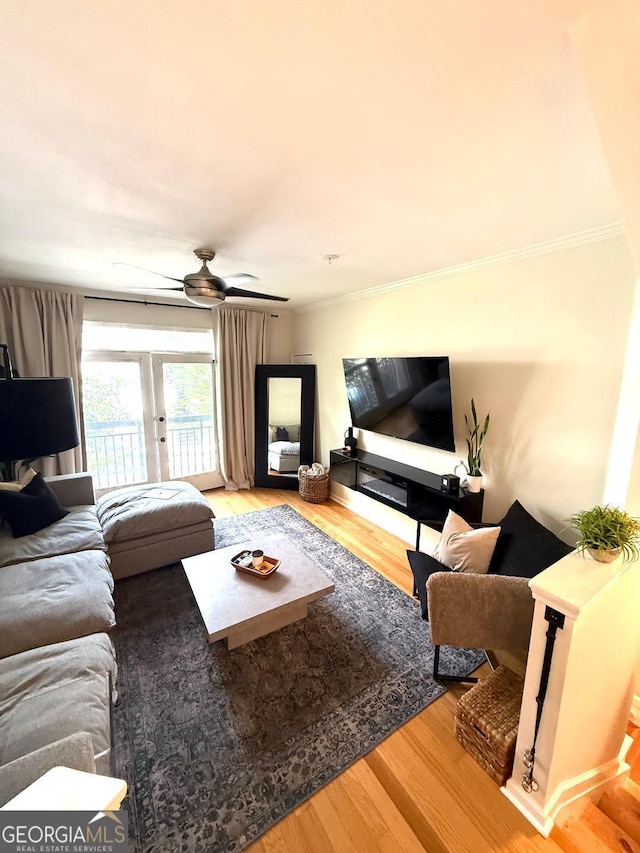 4248 River Green Dr NW Unit 312, Atlanta, GA 30327 - living room with wood finished floors, crown molding, and ceiling fan