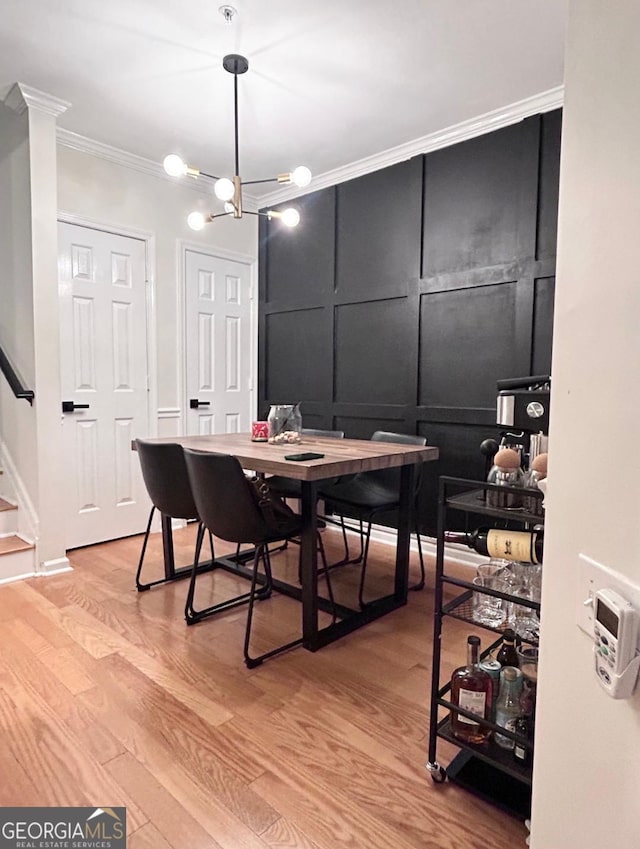 4248 River Green Dr NW Unit 312, Atlanta, GA 30327 - dining space with crown molding, light wood-type flooring, an office area, and stairs