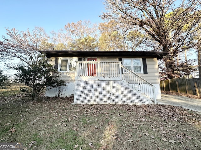 view of front of house featuring a wooden deck