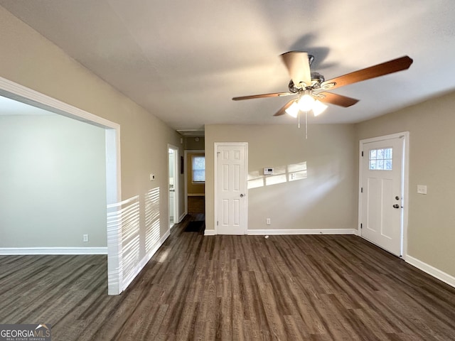 entryway with ceiling fan and dark hardwood / wood-style flooring