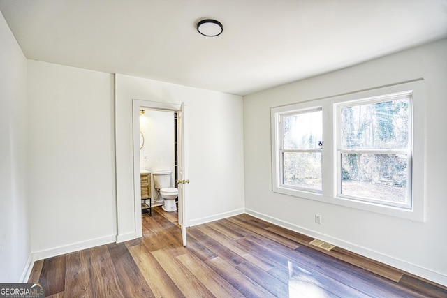 spare room featuring hardwood / wood-style flooring