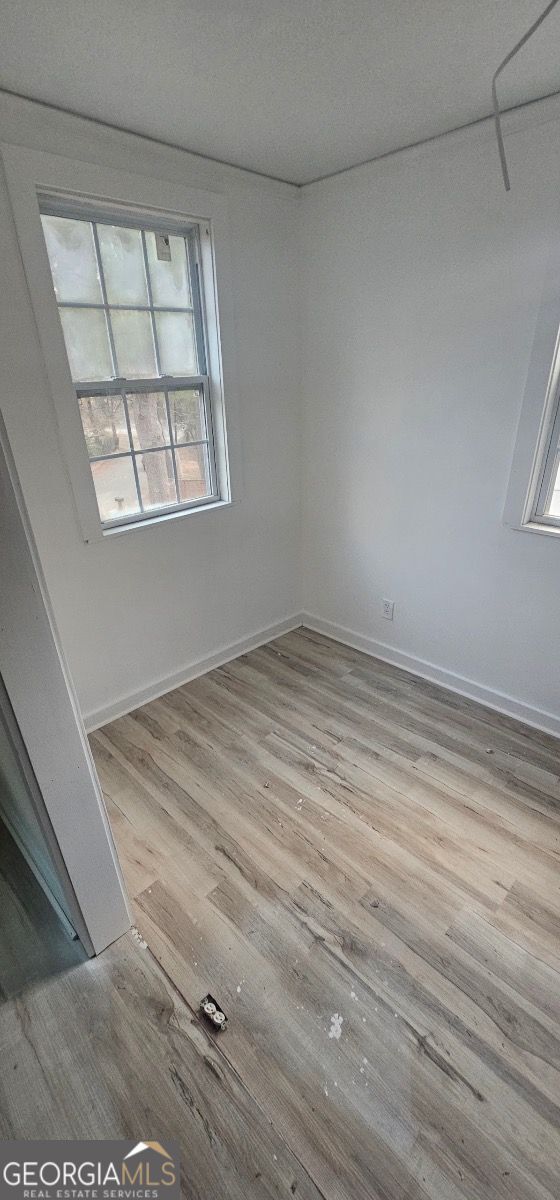 spare room featuring light hardwood / wood-style flooring