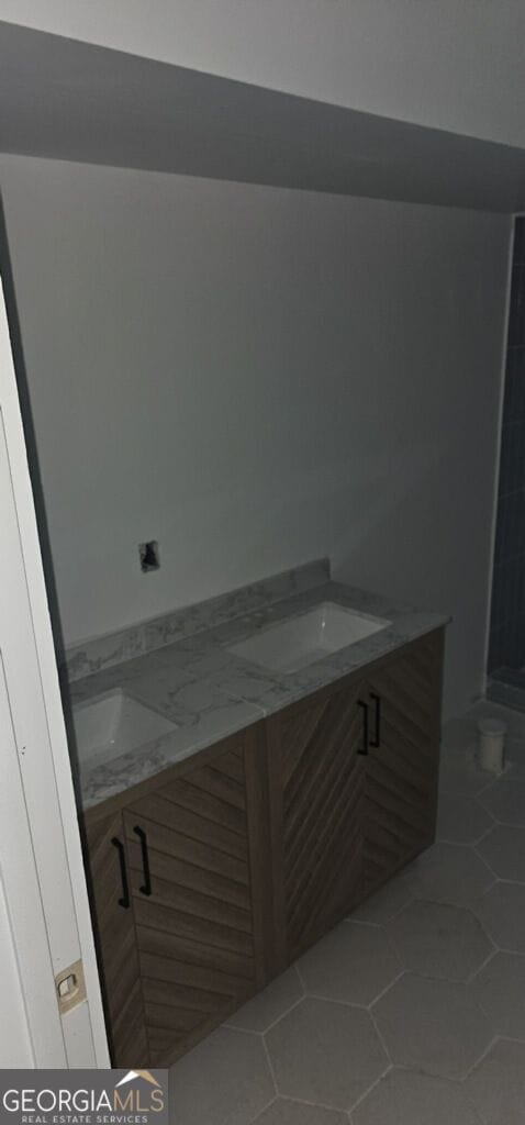 bathroom featuring tile patterned floors and vanity