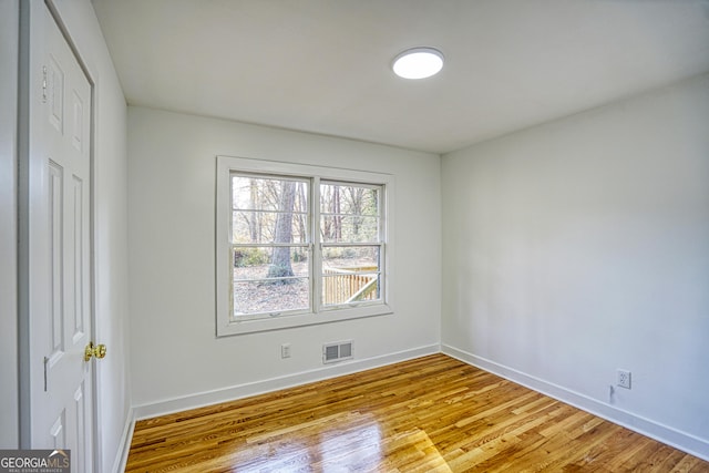 unfurnished room featuring light hardwood / wood-style flooring