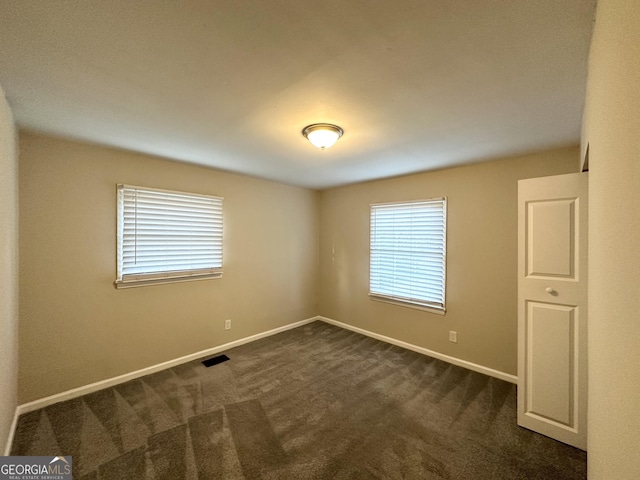 view of carpeted spare room