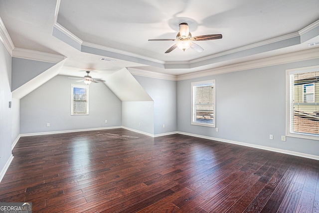 bonus room featuring ceiling fan, plenty of natural light, and dark hardwood / wood-style floors