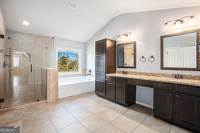 bathroom featuring tile patterned floors, vanity, lofted ceiling, and shower with separate bathtub