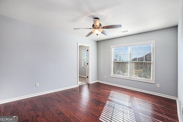 empty room featuring hardwood / wood-style flooring and ceiling fan