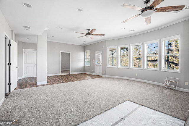 unfurnished living room featuring dark hardwood / wood-style floors, ceiling fan, and crown molding