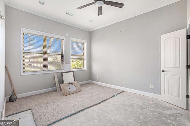 empty room with ceiling fan and crown molding