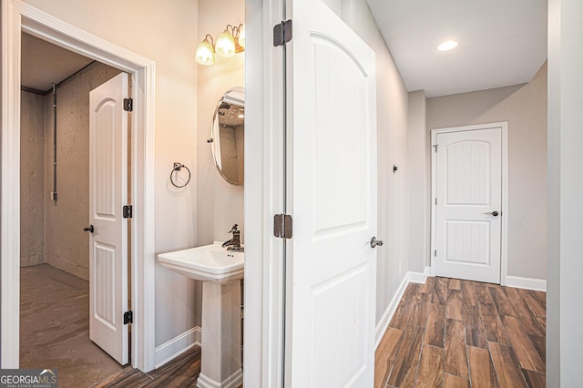 hall with dark wood-type flooring