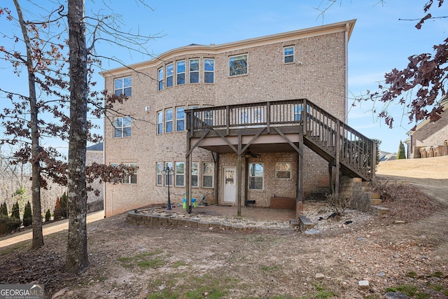 back of property featuring a wooden deck