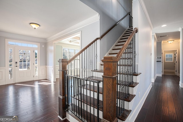 entryway with dark hardwood / wood-style flooring and ornamental molding