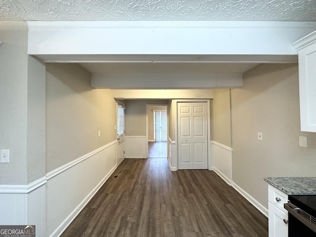 hall with dark hardwood / wood-style flooring