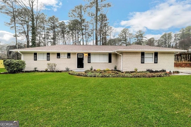 ranch-style home featuring a front yard