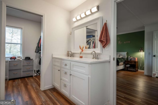 bathroom featuring vanity and hardwood / wood-style flooring