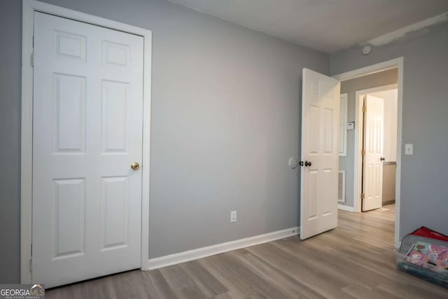 unfurnished bedroom with light hardwood / wood-style flooring