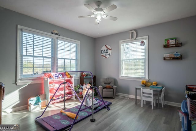 game room with ceiling fan and hardwood / wood-style flooring