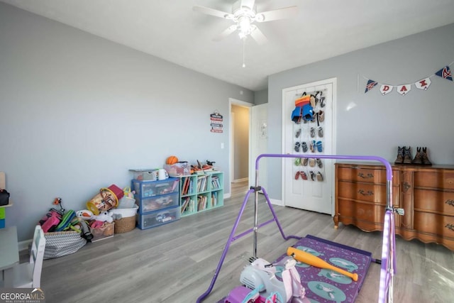 bedroom with ceiling fan and light hardwood / wood-style floors