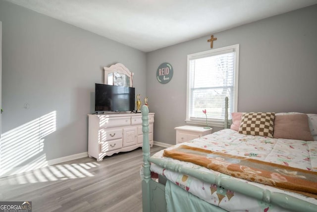 bedroom featuring light wood-type flooring