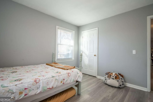 bedroom featuring hardwood / wood-style floors