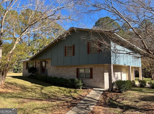 view of property exterior featuring a lawn