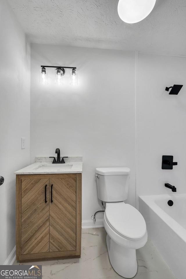 full bathroom featuring vanity, tub / shower combination, a textured ceiling, and toilet