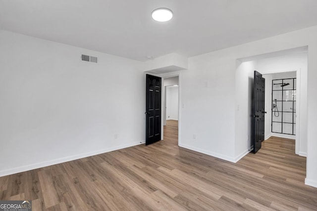 empty room featuring light hardwood / wood-style floors