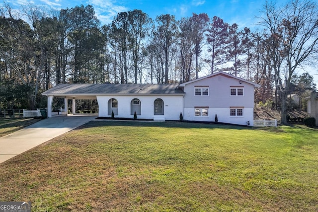 view of front of house with a front lawn and a carport