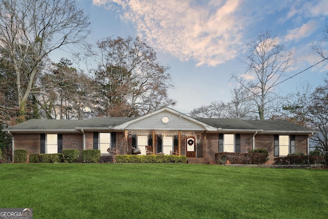 ranch-style home with a front yard