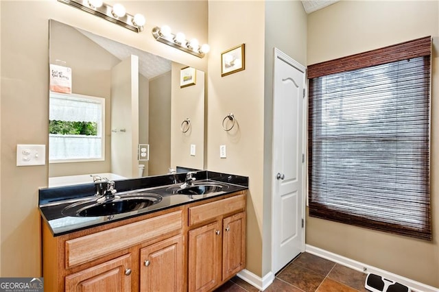 bathroom with tile patterned flooring and vanity