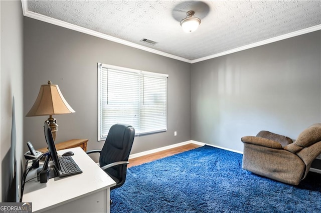 home office with a textured ceiling and ornamental molding