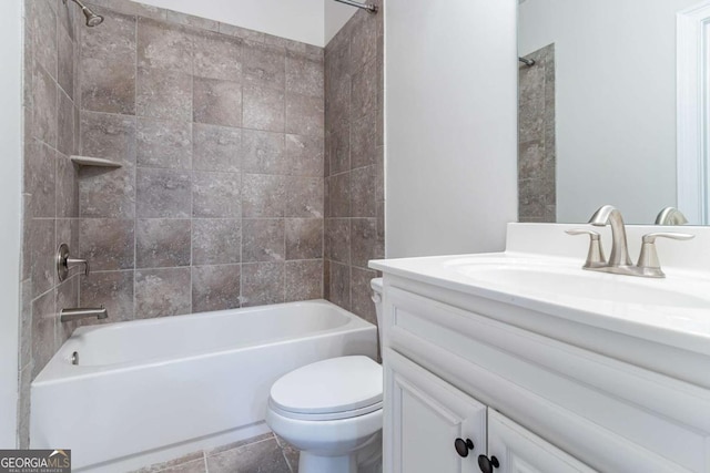 full bathroom with tile patterned floors, vanity, toilet, and tiled shower / bath combo