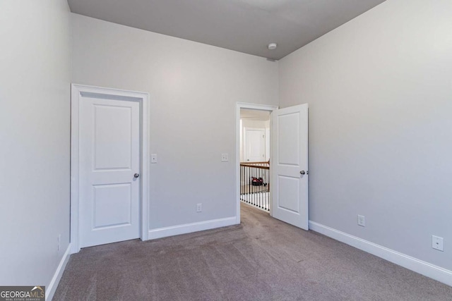 unfurnished bedroom featuring carpet flooring