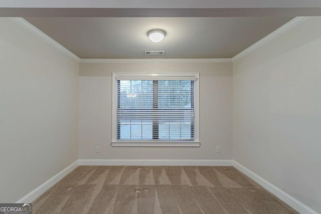 carpeted empty room with ornamental molding