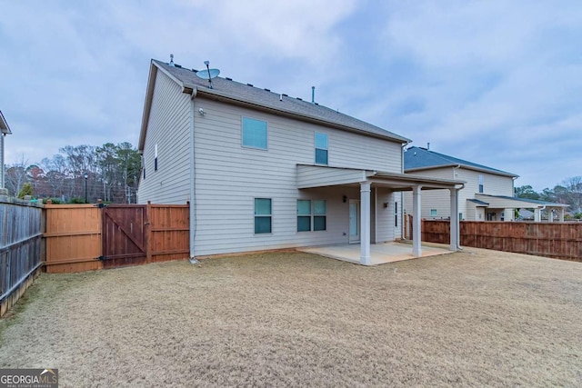 rear view of house with a patio