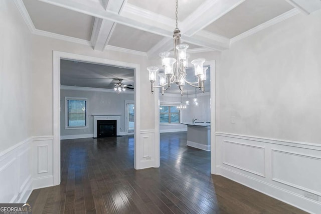 unfurnished dining area with beam ceiling, dark hardwood / wood-style floors, and crown molding