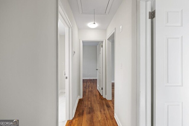 hallway featuring dark hardwood / wood-style floors