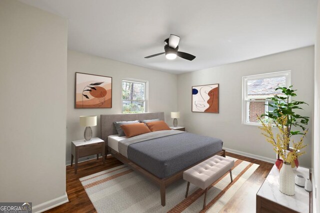 bedroom with ceiling fan and dark wood-type flooring